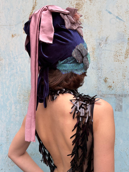 “The morning after the rain, you opened the door and saw frost on flowers still in bloom” hat